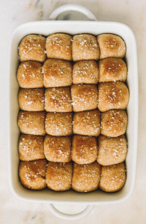 soft whole wheat dinner rolls in white baking dish