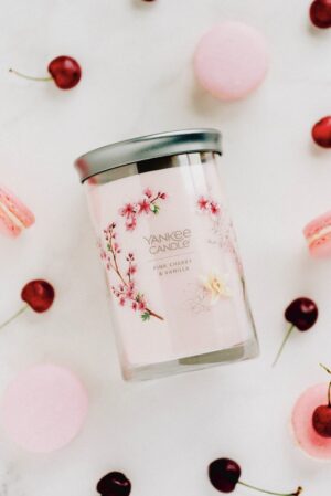 cherry vanilla macarons on white marble counter